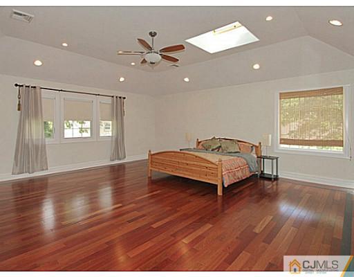 1881 Raritan Road Scotch Plains, NJ 07076 - Photo 12 of 18 a spacious bedroom with a bed and window