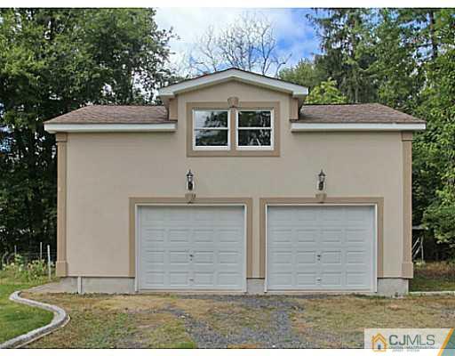 1881 Raritan Road Scotch Plains, NJ 07076 - Photo 17 of 18 a front view of a house with a yard