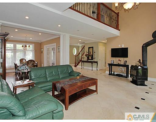 1881 Raritan Road Scotch Plains, NJ 07076 - Photo 4 of 18 a living room with furniture and a flat screen tv
