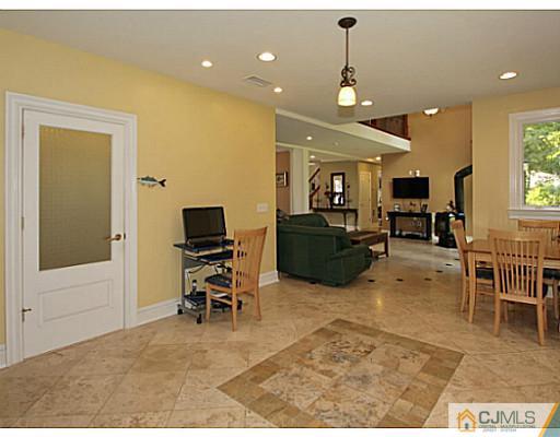 1881 Raritan Road Scotch Plains, NJ 07076 - Photo 6 of 18 a living room with furniture and a flat screen tv