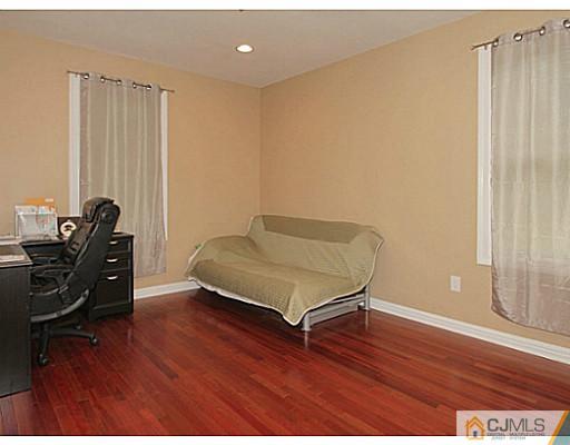 1881 Raritan Road Scotch Plains, NJ 07076 - Photo 7 of 18 a living room with furniture rug and wooden floor