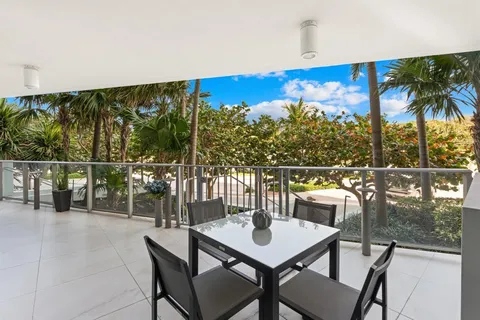 a view of a chairs and table in patio