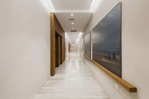 a living room with furniture and a painting