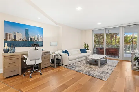 a living room with furniture rug and window