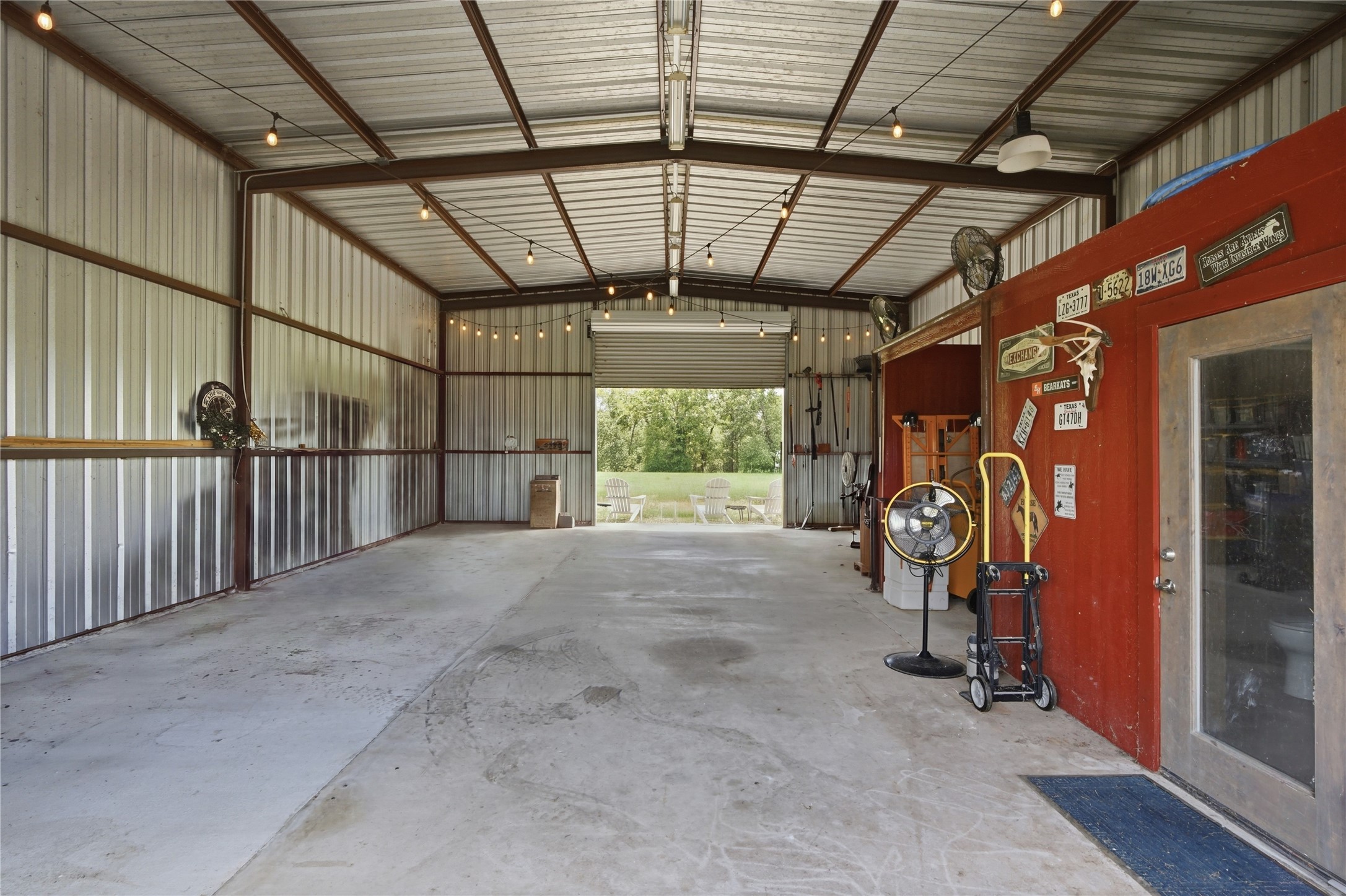 681 Emma Road Oakhurst, TX 77359 - Photo 24 of 30 Barn has horse stalls along with a storage room and half bath.
