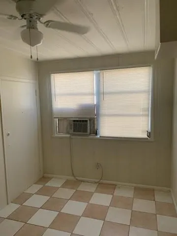 a view of a kitchen with a window