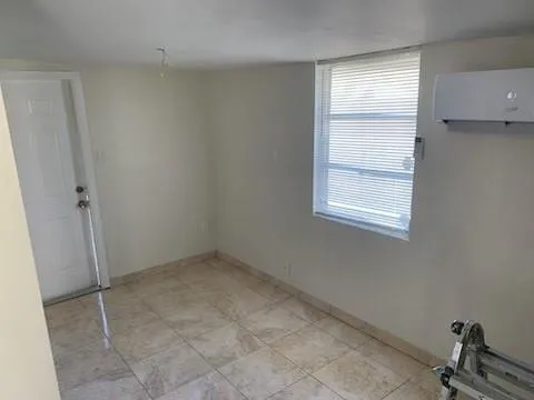 a view of an empty room and window