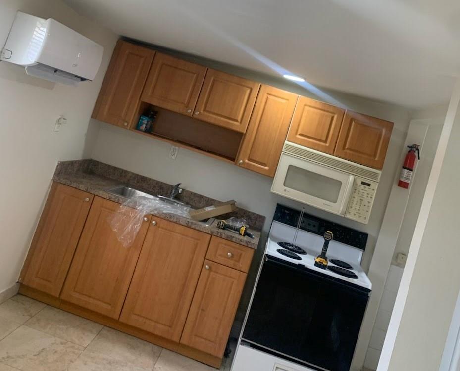 2830 Northeast 7th Terrace Pompano Beach, FL 33064 - Photo 10 of 11 a utility room with dryer and washer