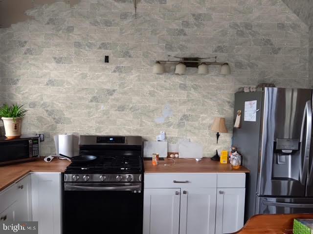 867 Kibler Road Quicksburg, VA 22847 - Photo 14 of 18 a kitchen with a stove and a refrigerator