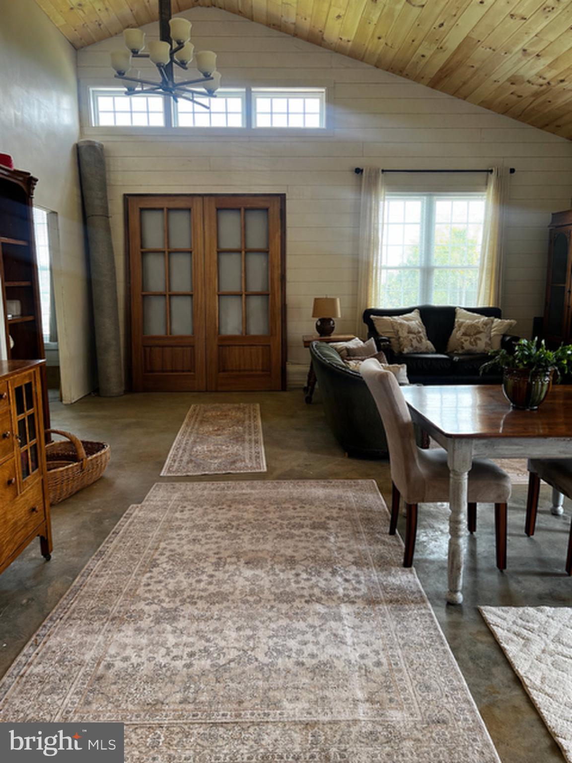 867 Kibler Road Quicksburg, VA 22847 - Photo 8 of 18 a living room with furniture a chandelier and a rug