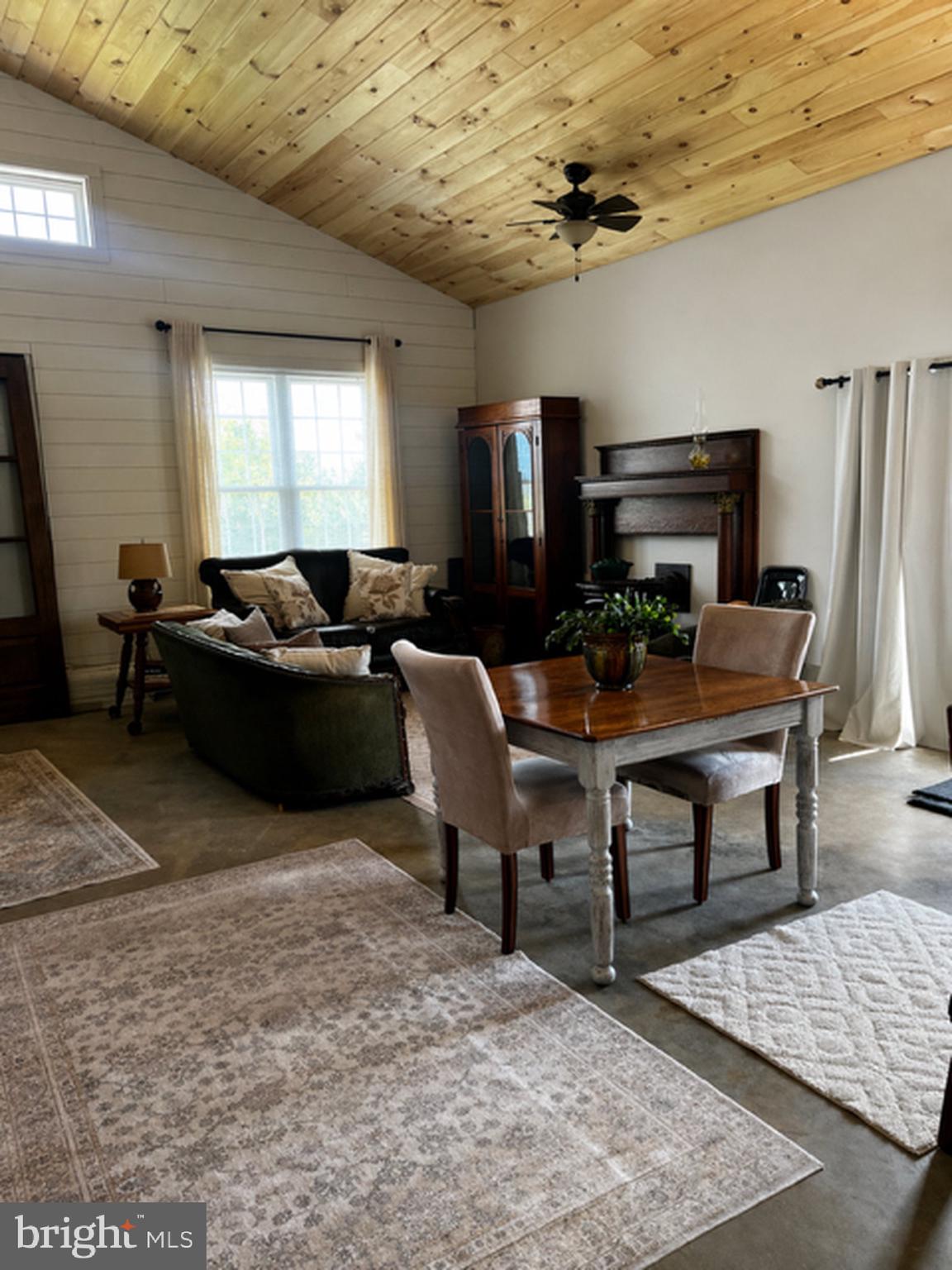 867 Kibler Road Quicksburg, VA 22847 - Photo 9 of 18 a living room with furniture a fireplace and a flat screen tv