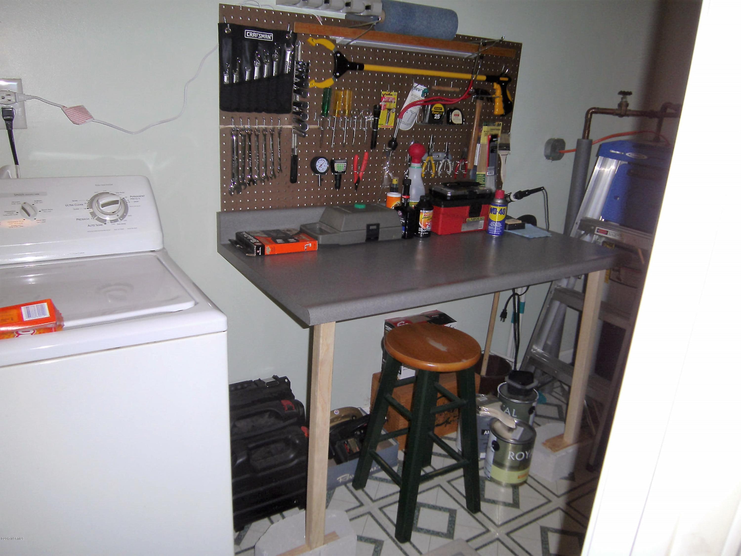 113 Murphy Road Davis, NC 28524 - Photo 9 of 15 Workshop table, off of the kitchen