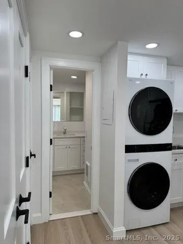 a view of a hallway with washer and dryer