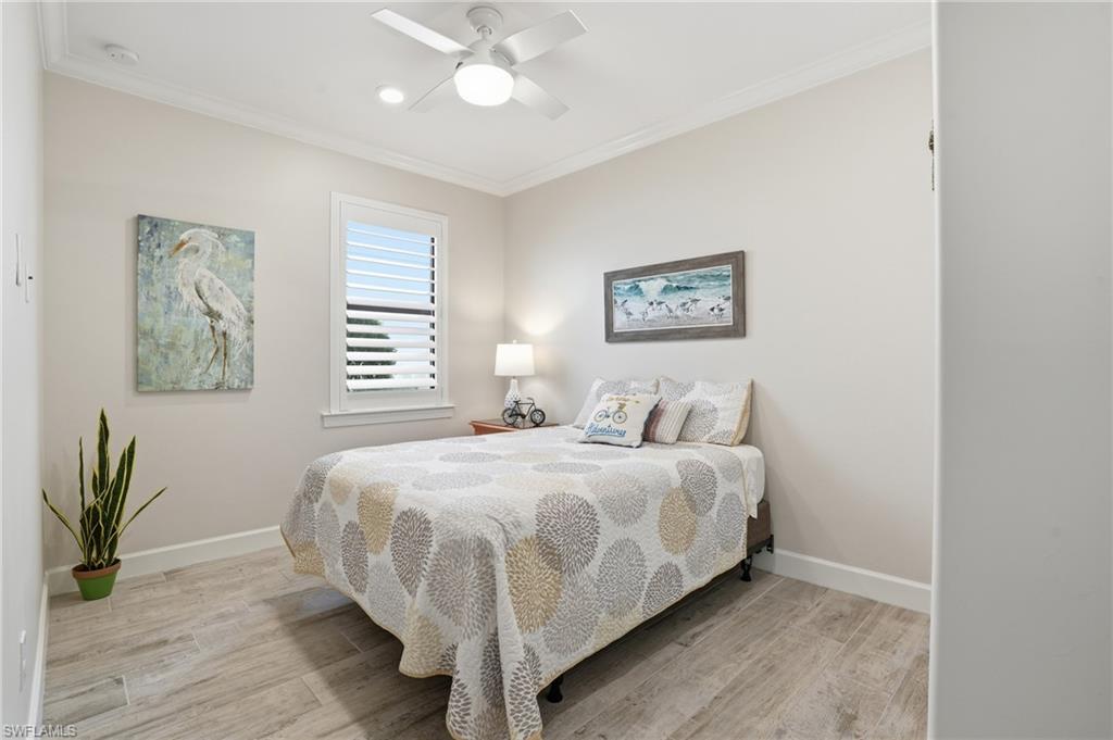17210 Ashcomb Way Estero, FL 33928 - Photo 27 of 47 a spacious bedroom with a bed and a window