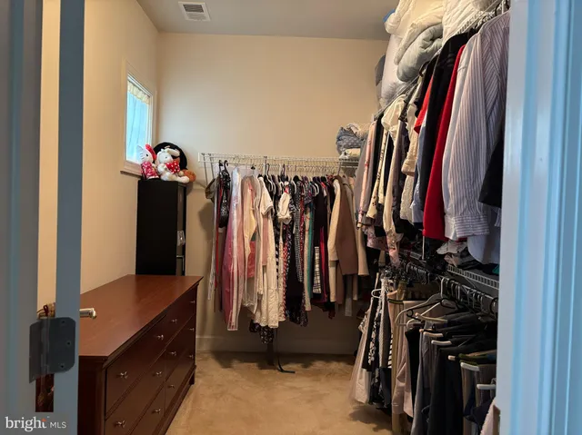 a dining table with chairs and window