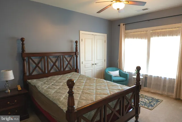 a bedroom with a bed and furniture