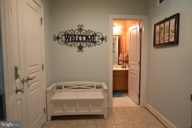 a blue couch sitting next to a window