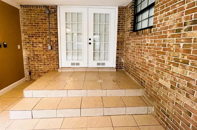 a view of a brick buildings with an empty space