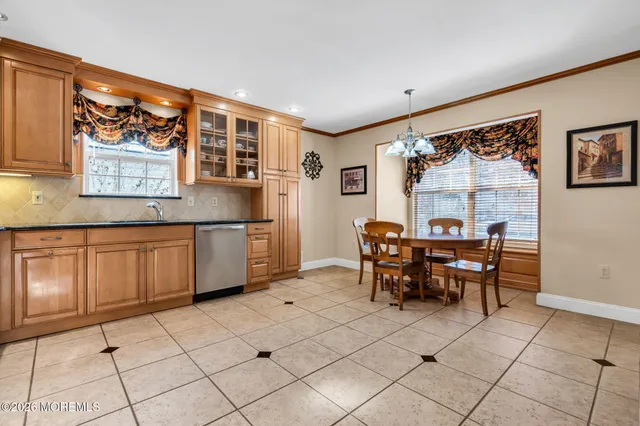 a kitchen with stainless steel appliances granite countertop a refrigerator stove and microwave