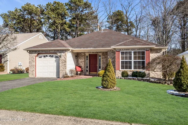 a view of a house with a yard and plants