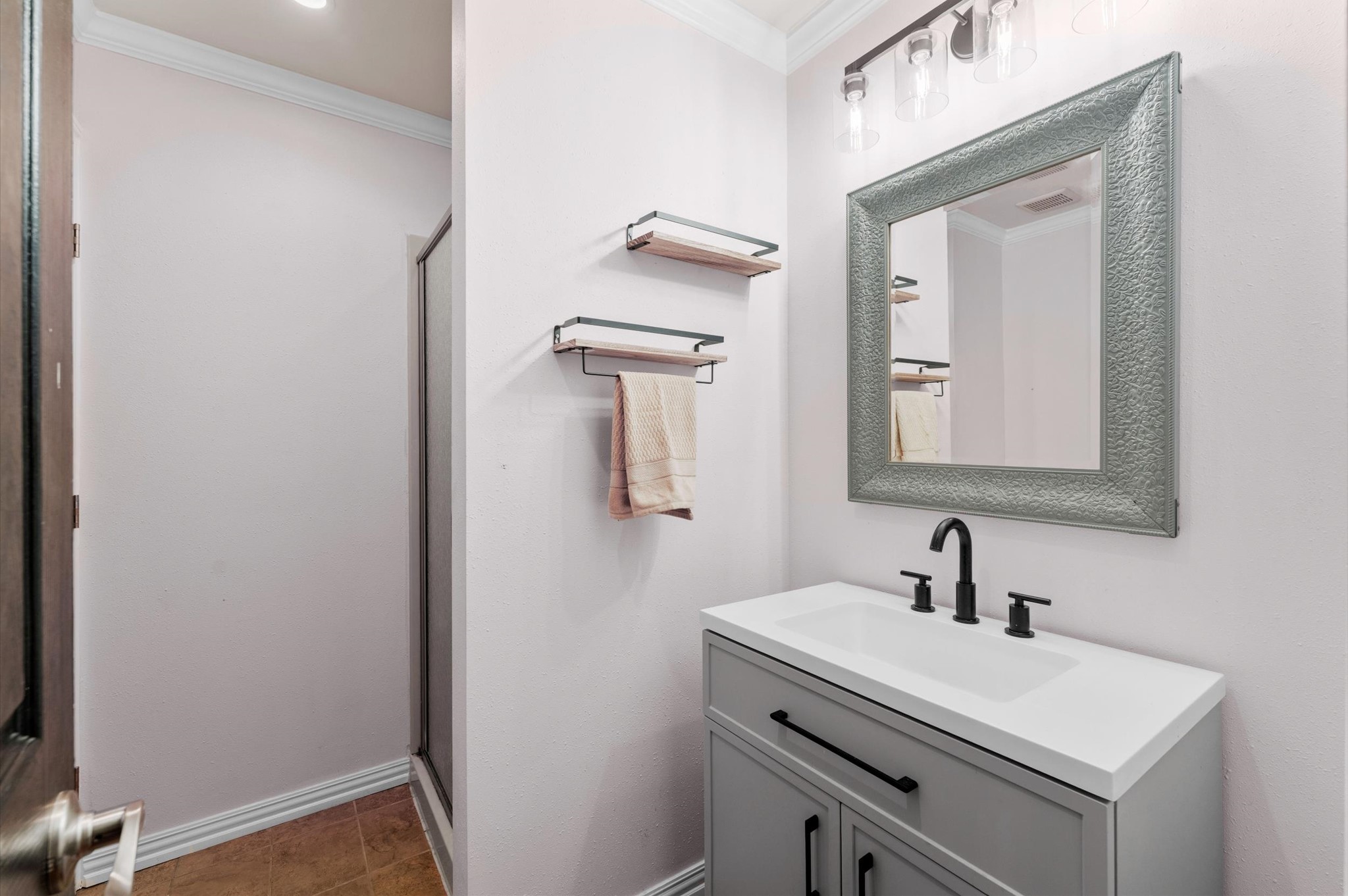 22634 Park Road Tomball, TX 77377 - Photo 22 of 29 Charming bathroom with shower, a sleek vanity, modern fixtures, and ample storage space.