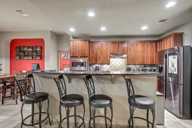 a bed room with a bed furniture and a flat screen tv