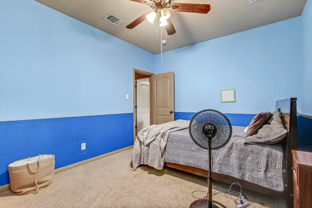 a bathroom with a sink double vanity and a mirror