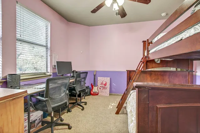 a bathroom with a sink mirror and tub