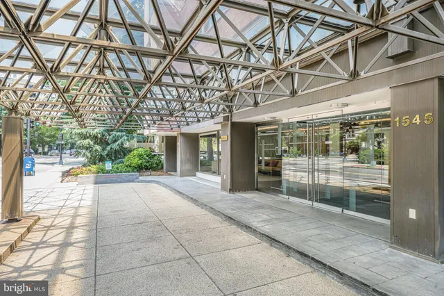 a view of a building with a backyard