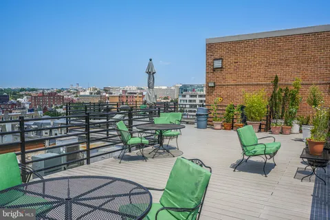 a view of a terrace with furniture