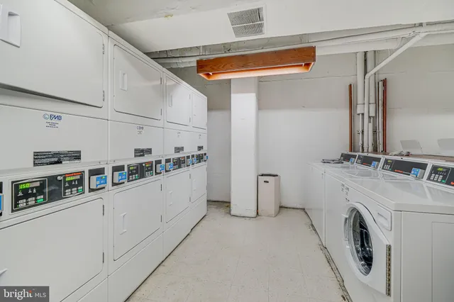 a front view of a building with a garden