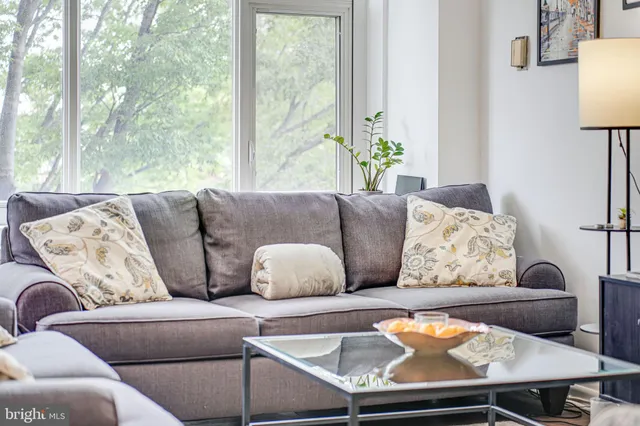 a living room with furniture and a large window
