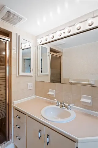 a bathroom with a sink and a mirror