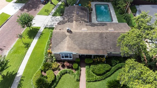 an aerial view of a house with a garden
