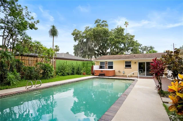 a house view with a sitting space and garden
