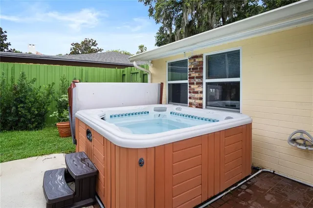 a view of a house with a sink and outdoor kitchen