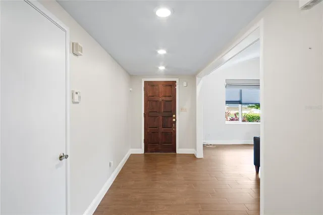 a view of gallery with wooden floor