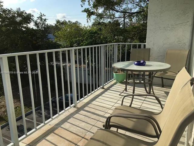 a view of balcony floor and furniture