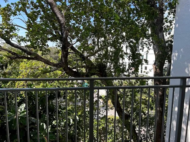 a view of house with a tree