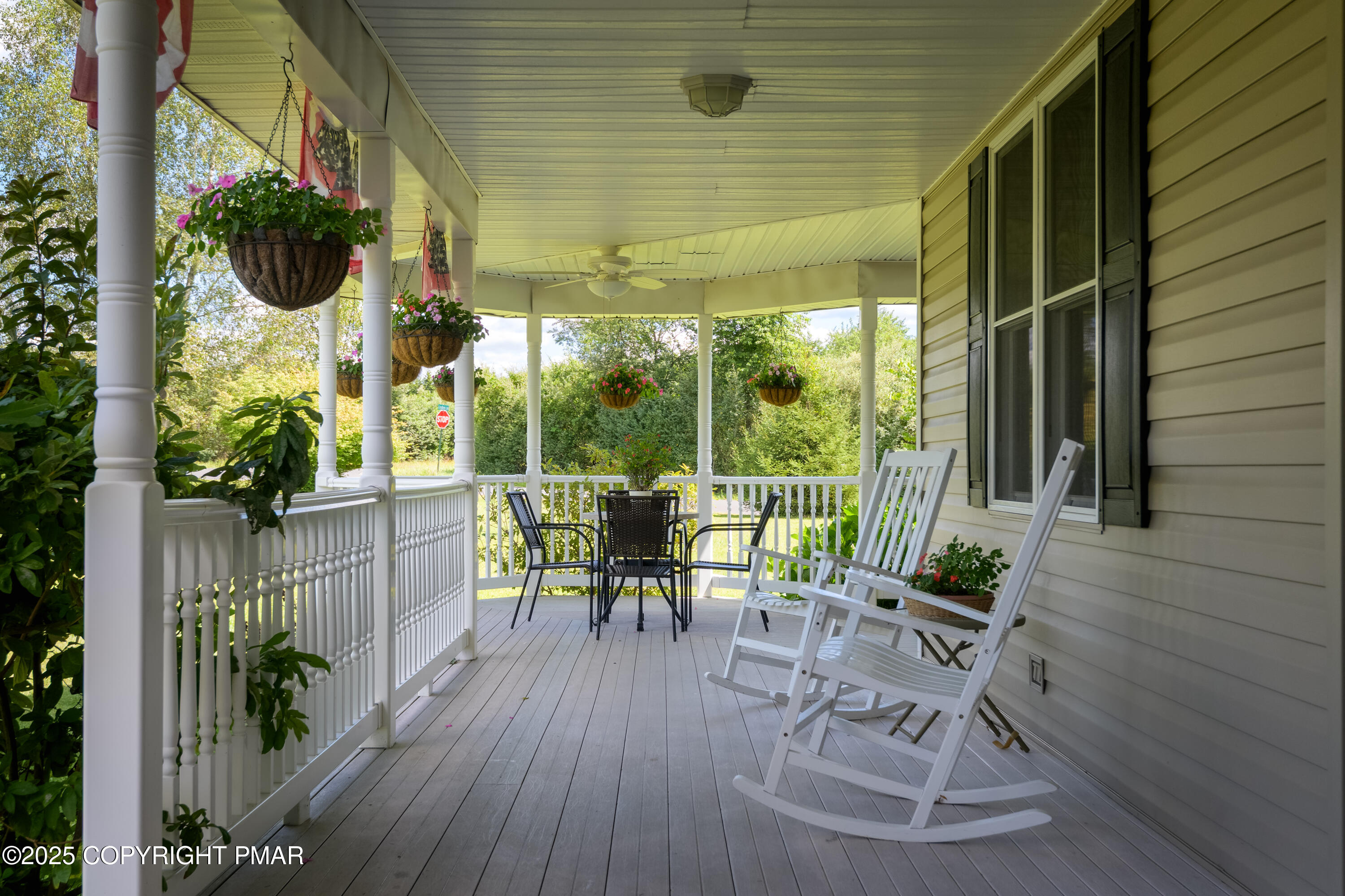 150 Red Oak Drive Palmerton, PA 18071 - Photo 17 of 76 a view of a patio with table and chairs potted plants with wooden floor and fence