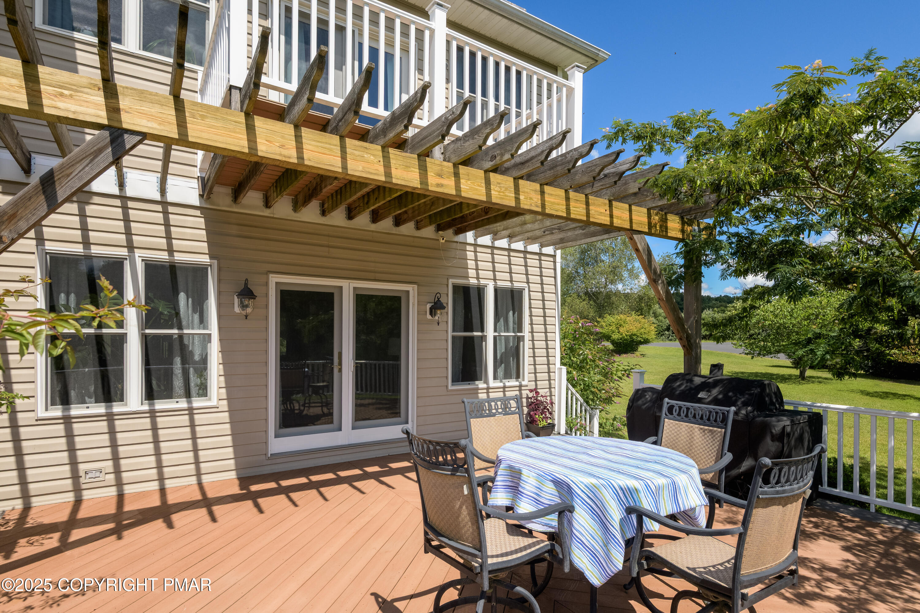 150 Red Oak Drive Palmerton, PA 18071 - Photo 19 of 76 a view of a patio with table and chairs with wooden floor and fence