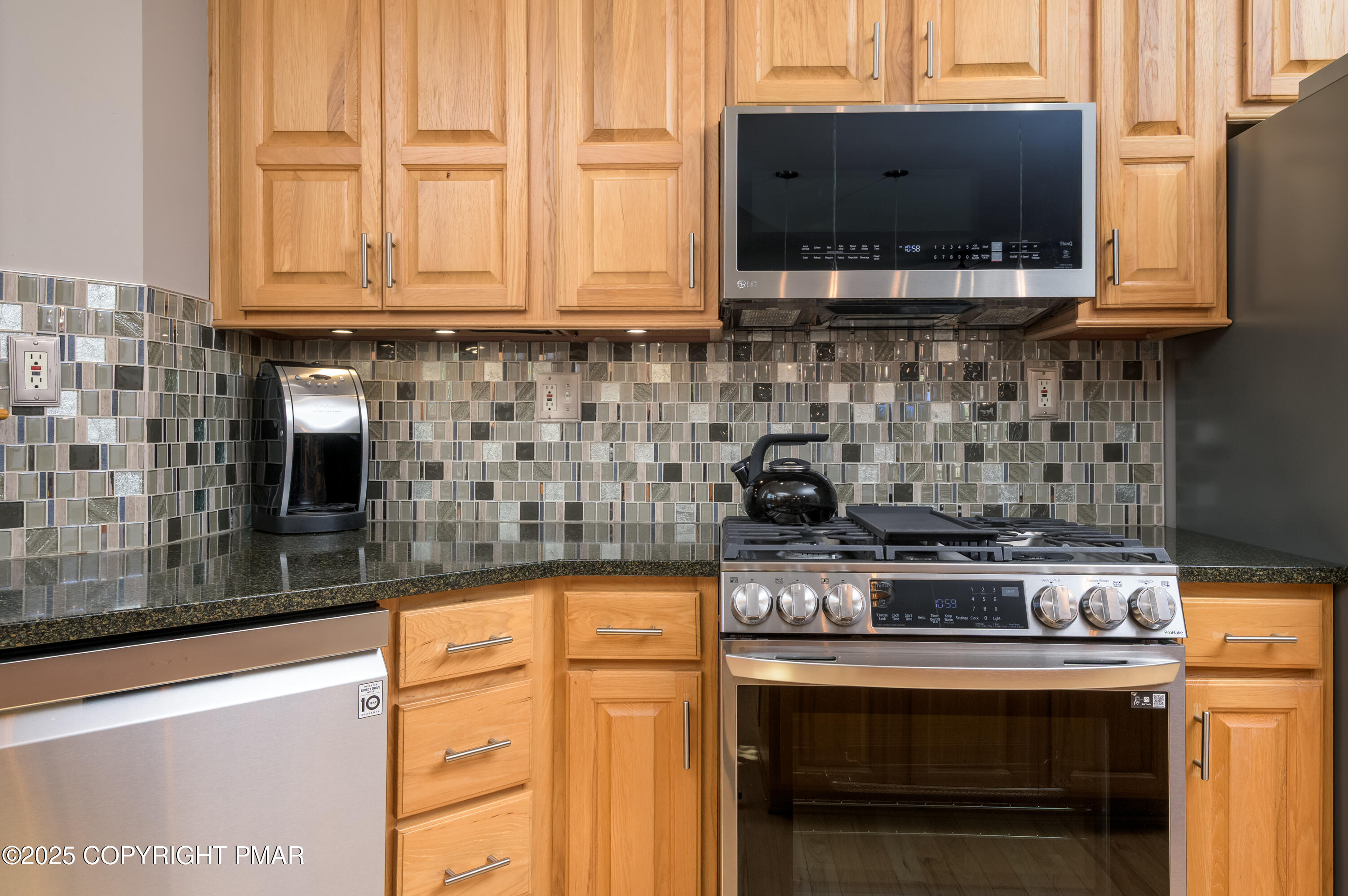 150 Red Oak Drive Palmerton, PA 18071 - Photo 32 of 76 a kitchen with stainless steel appliances granite countertop a stove and a microwave