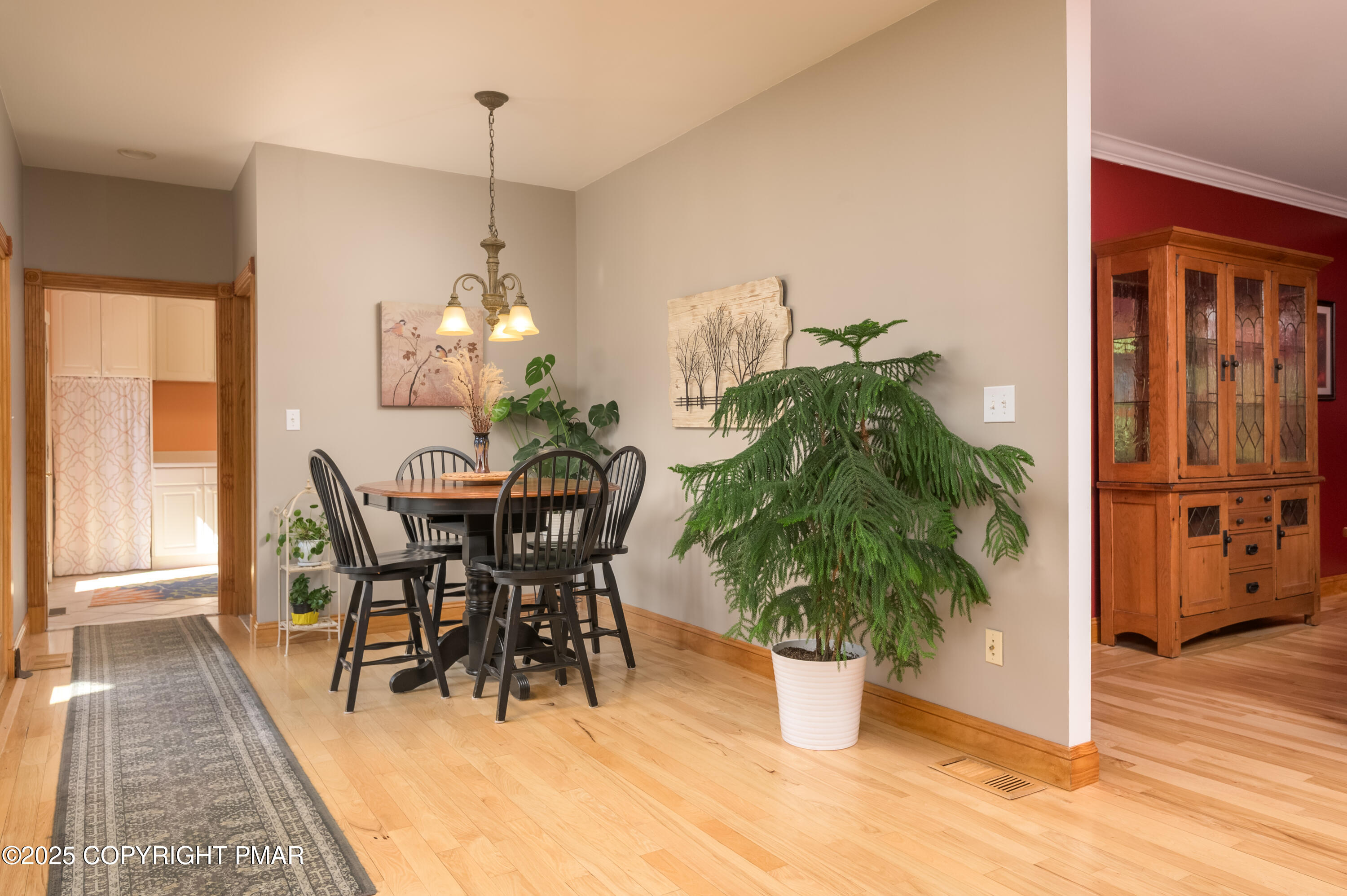 150 Red Oak Drive Palmerton, PA 18071 - Photo 34 of 76 a dining room with furniture potted plants and wooden floor