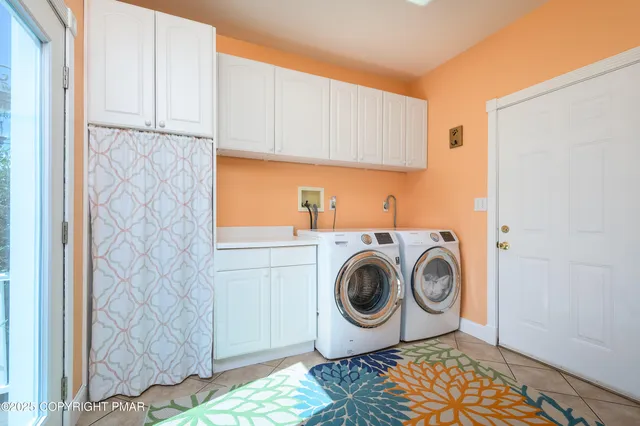a white bath tub sitting in a bathroom
