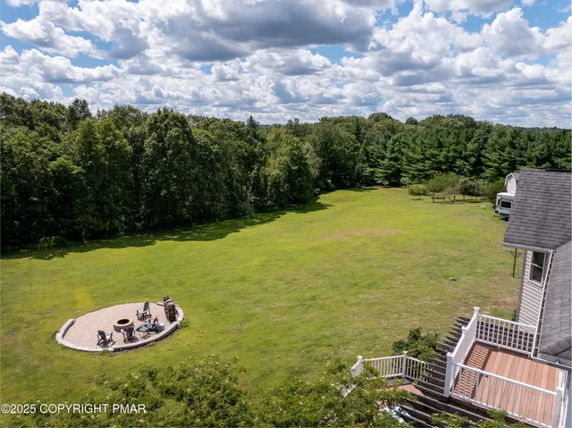 an aerial view of residential house with outdoor space