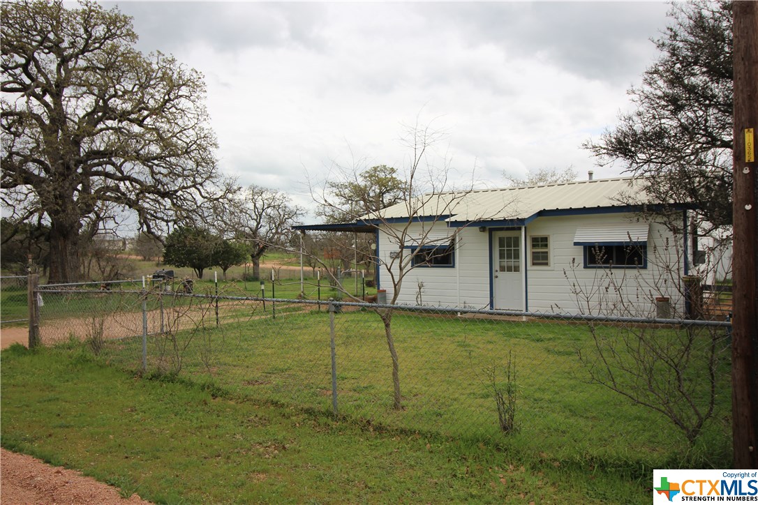 240 Wade Tow, TX 78672 - Photo 1 of 1 a backyard of a house with table and chairs