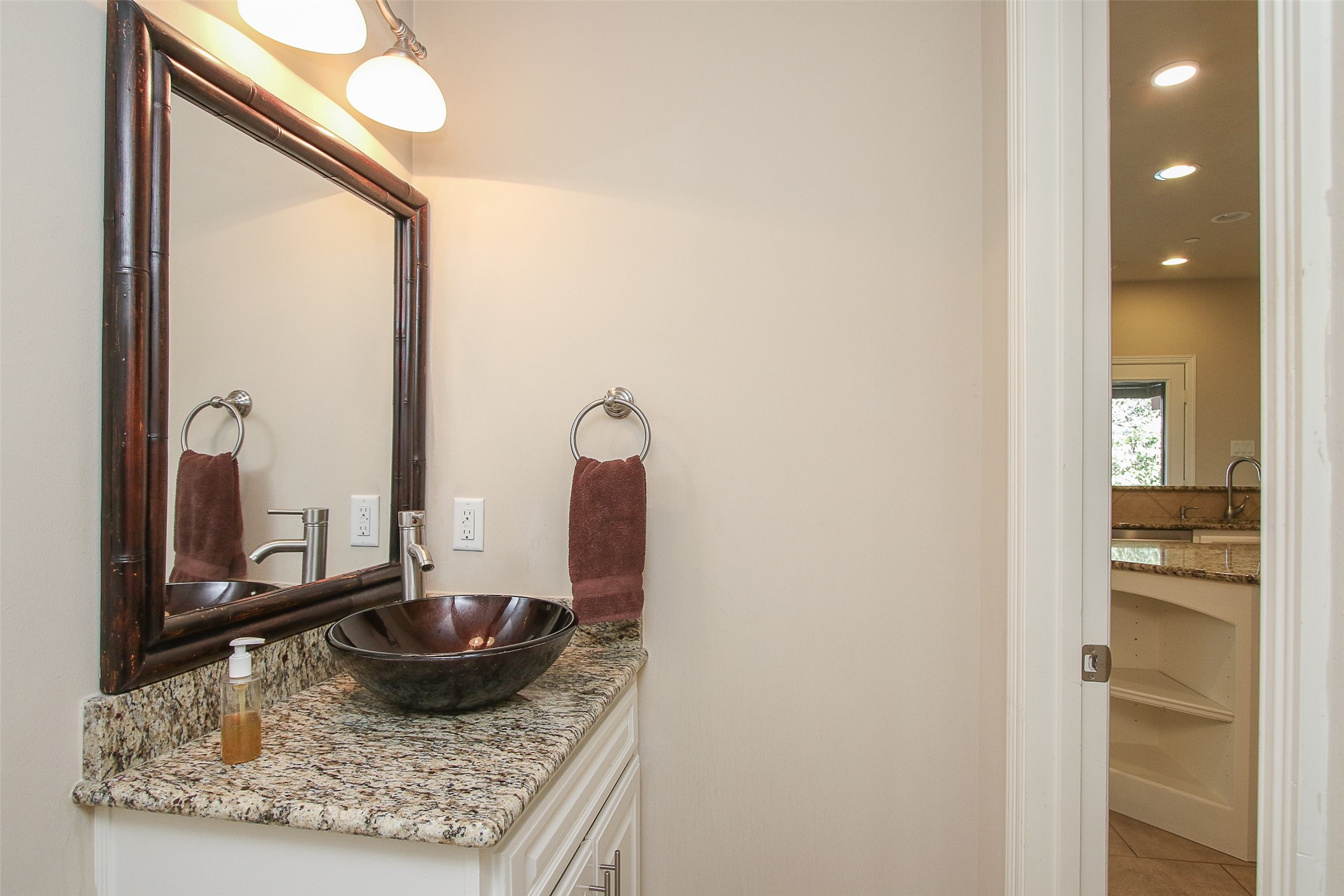 11722 Spriggs Way Houston, TX 77024 - Photo 21 of 49 Half bath located conveniently between the kitchen and dining room