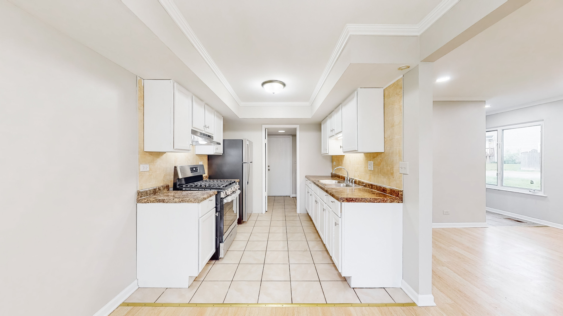 20 Elm Court, Unit 3 Bolingbrook, IL 60440 - Photo 11 of 21 a kitchen with a sink a counter top space stainless steel appliances and cabinets
