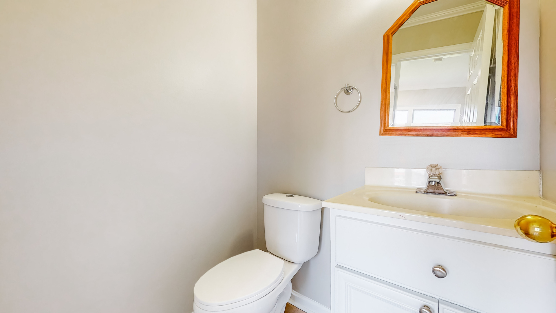 20 Elm Court, Unit 3 Bolingbrook, IL 60440 - Photo 13 of 21 a white toilet sitting next to a bathroom sink