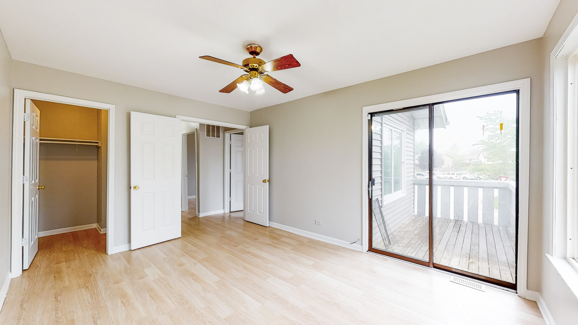20 Elm Court, Unit 3 Bolingbrook, IL 60440 - Photo 17 of 21 a view of an empty room with wooden floor and a window